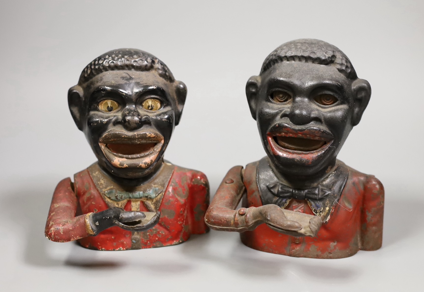 Two vintage cast iron money banks, 19cm tall